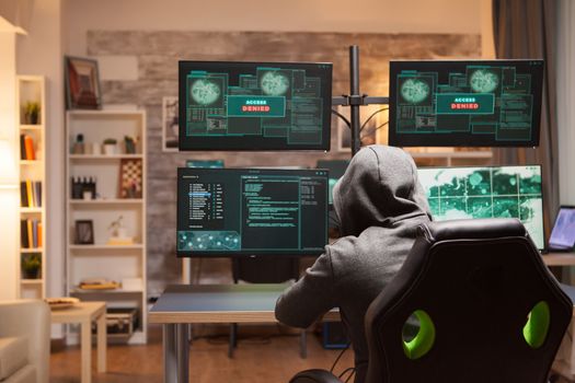 Access denied for male hacker wearing a hoodie