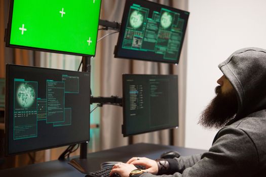 Bearded man hacking his government servers