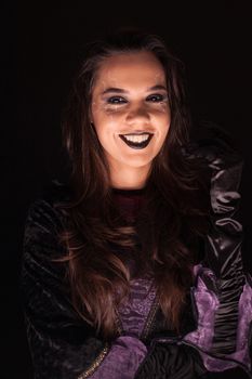 Young woman with a witch outfit for halloween