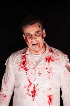Scary zombie with blood on him after a murder