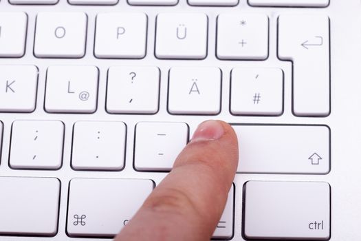 Finger pressing on keyboard