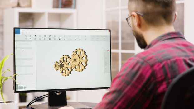 Male engineer working on a 3d design from home