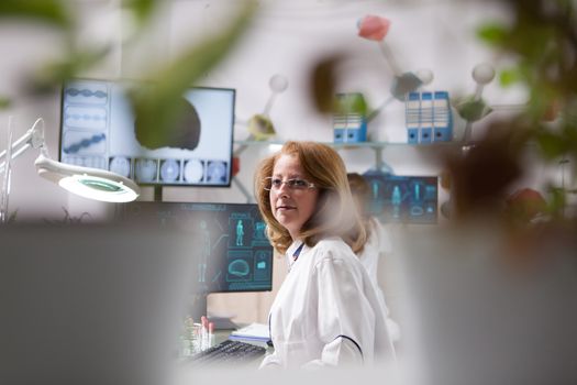 Portrait of middle age woman in a plant laboratory