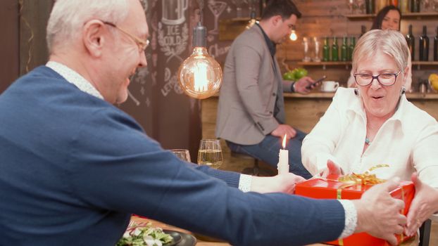 Couple in their sixties feeling good in a restaurant