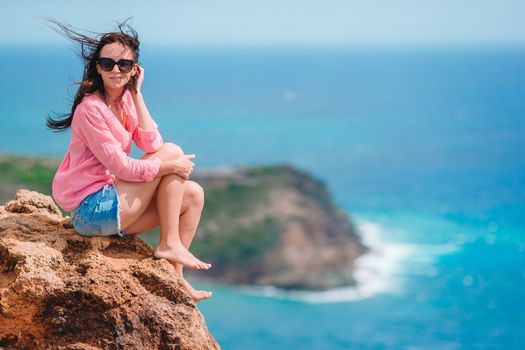 Young woman enjoying breathtaking views of beautiful landscape