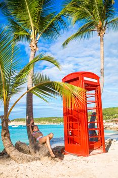 Beautiftul kid near red phone booth in Dickenson's bay Antigua.