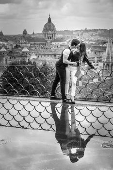 Romantic couple in holiday in Rome city, Italy. Passion and complicity between two young lovers.