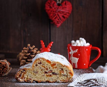 traditional European cake Stollen with nuts and candied fruit 