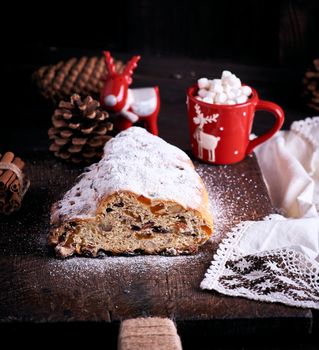 traditional European cake Stollen with nuts and candied fruit