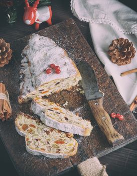 Stollen baked traditional European cake with nuts and candied fr