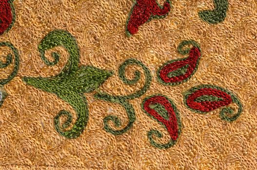 background from the tissue and textile with oriental ornament ornate pattern and gold color in the form of a flower