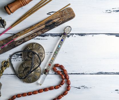 stone rosary and incense sticks 