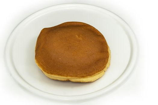 Dorayaki , Japanese traditional red-bean pancake dessert on white plate