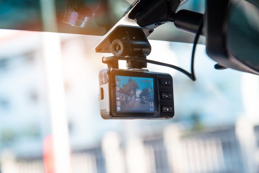 Car video camera attached to the windshield to record driving an