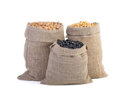 Jute sacks with dried peas, soja beans and black legume