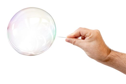 soap bubble and a males hand with needle to let it pop