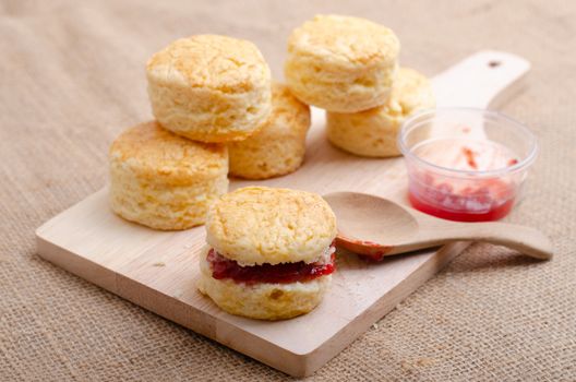 Homemade Cheese Scones with jam strawberry  on the wood Plate