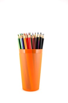 Color pencils in the orange prop over white