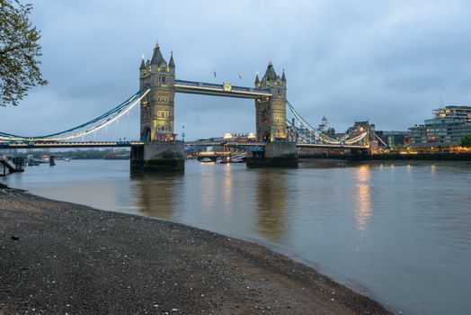 View of thr Tower Bridge in London at dusk on a cloudy day