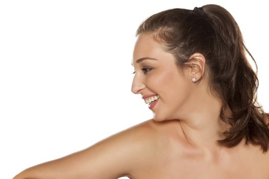 Profile of smiling young woman with a pony tail