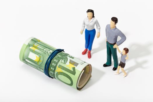 Human representation of a family looking at a Roll of money
