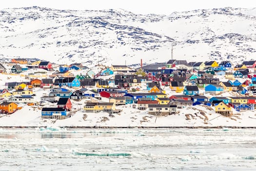 Arctic city center panorama with colorful Inuit houses on the ro