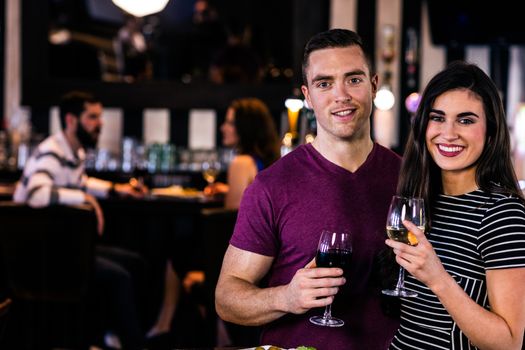 Portrait of couple having a glass of wine