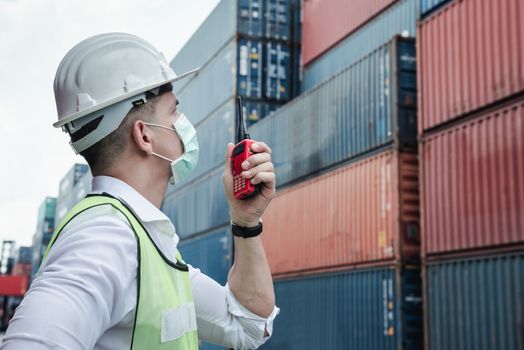 Container Logistics Shipping Management of Transportation Industry, Transport Engineer Control Via Walkie-Talkie to Worker in Containers Shipyard. Business Cargo Ship Import/Export Factory Logistic.