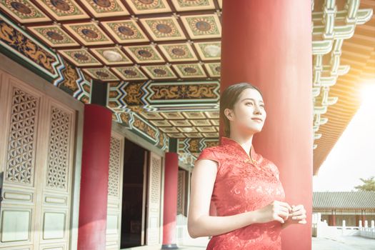 Asian young woman in  traditional Chinese dresses in the Temple