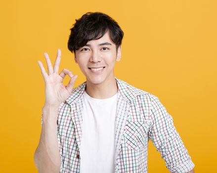 young man hand showing ok sign