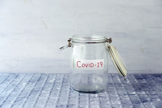 Empty money jar with covid19 label