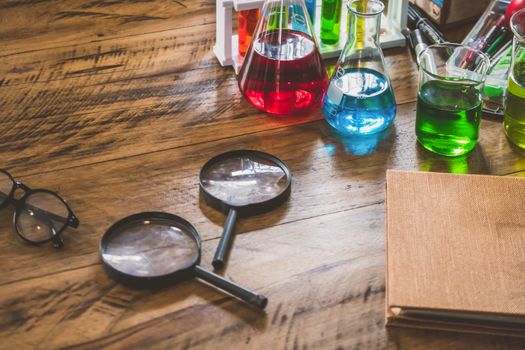 Chemistry equipment set on the wooden table.