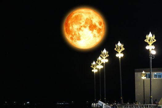full blood moon on night sky and Naga light pole