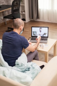 Man in a video call with doctor