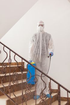 Disinfectant working in protective suit