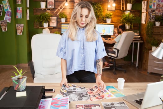 Creative female dressmaker working in a modern office