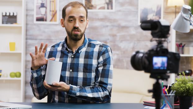 Famous vlogger filming smart speaker review for his followers