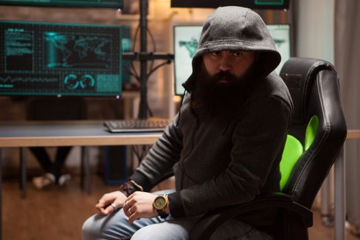 Dangerous bearded hacker wearing a hoodie