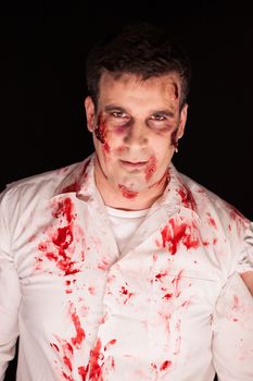 Zombie with blood on him after a kill over black background