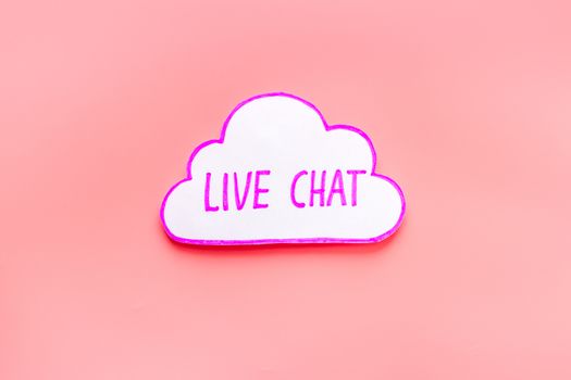 Live chat communication concept - words on pink background top view