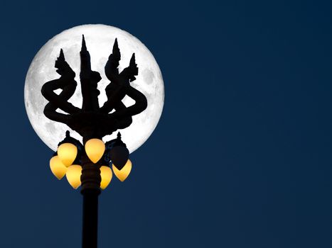 super full moon silhouette naga light lantern pillar