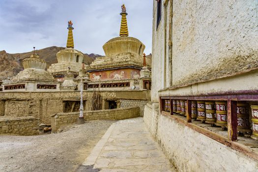 Buddhist stupa and prayer wheels at Lamayuru gompa monastery, Ladakh, India