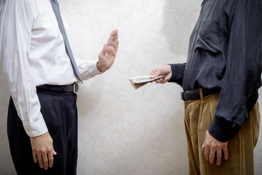 Man Offering  a Dollars bribe to a Man Refusing it