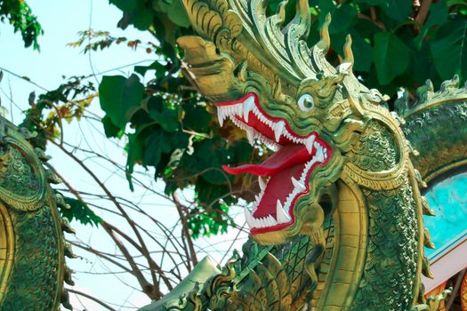 The art of Thai culture, stucco, green Naga decorated by the roo