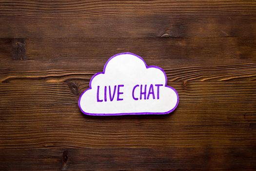Live chat communication concept - words on wooden background top view