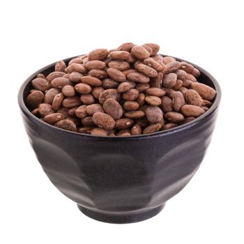 pinto beans  in a ceramic bowl isolated on a white background.