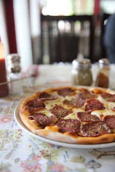 Pepperoni pizza , pizza with pepperoni mozzarella cheese and tom