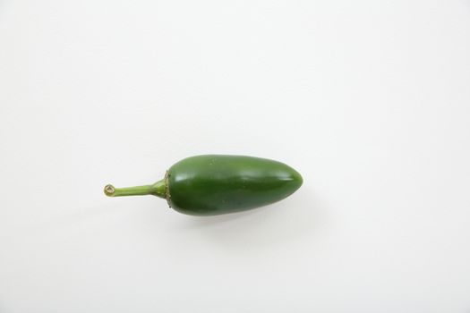green jalapeno chili pepper isolated in white background