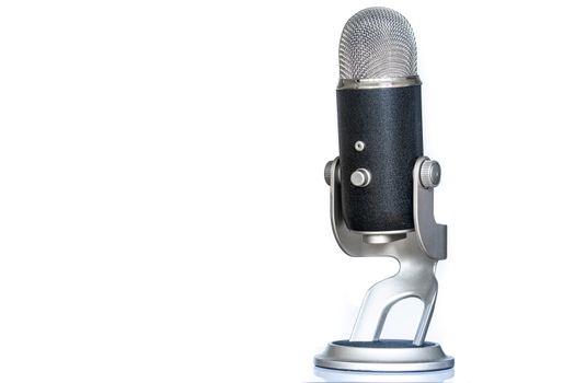 Microphone with classic and vintage look standing up. Used for podcasting or other voice recording.