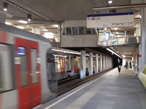 Rotterdam, Netherlands, September 2019: People waiting for the train in the subway of Rotterdam, ready to commute
